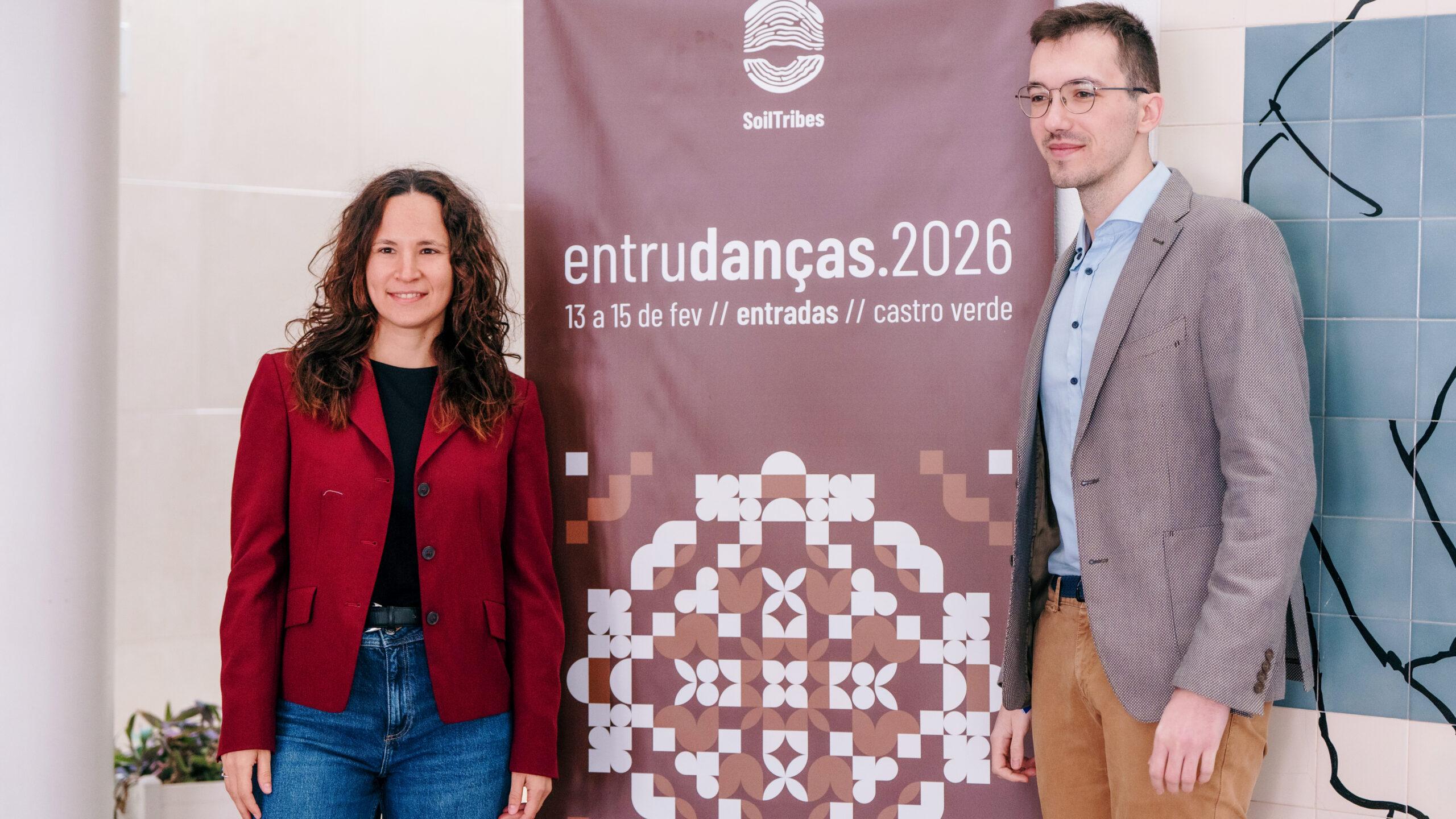 Silvia Diazzi and Stefanos Stagakis posing in front of a SoilTribes banner.